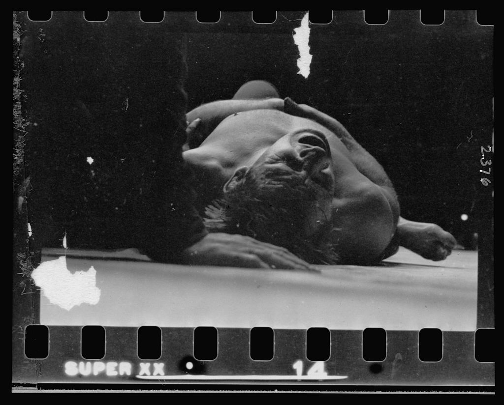 Gorgeous George pinning another wrestler to the mat, 1949. Stanley Kubrick.