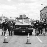 A police barricade around the time of the Baltimore Uprising last spring. James Jamieson / Flickr