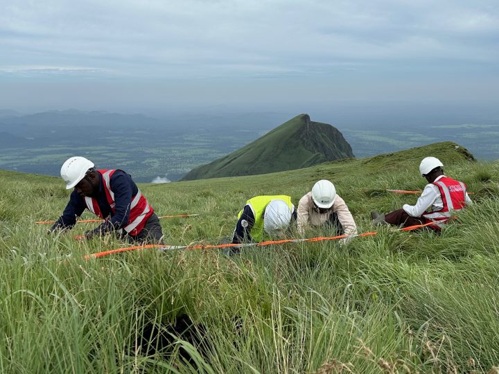 Workers on a mountain.
