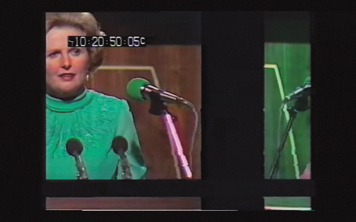 Still frame from the documentary Shifty, showing Margaret Thatcher giving a speech in a green top.